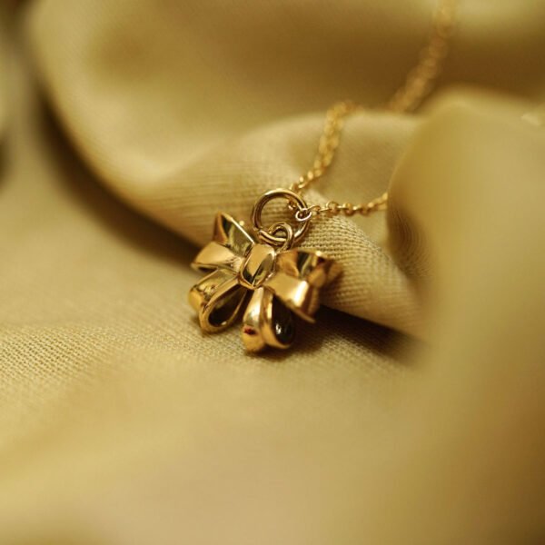 Elegant Gold Bow Pendant Necklace - Alinora Jewels - Image 4